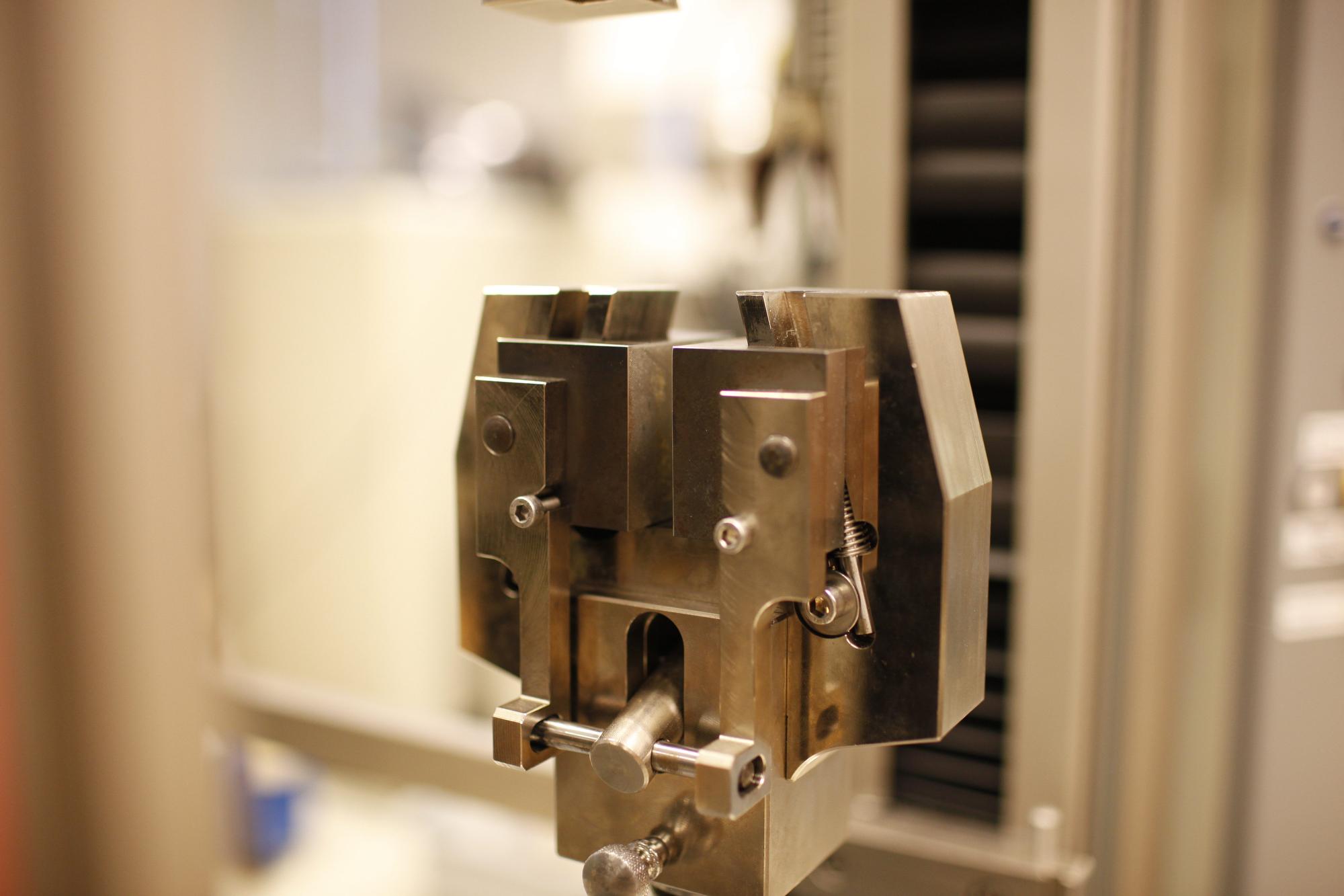 A closeup image of part of a ZwickRoell tensile strength testing machine