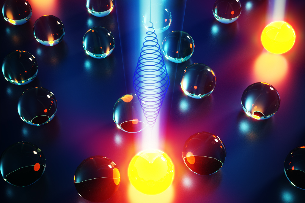 A yellow light illuminates a cluster of spheres, representing quantum dots, showcasing MIT chemists' innovative control method.