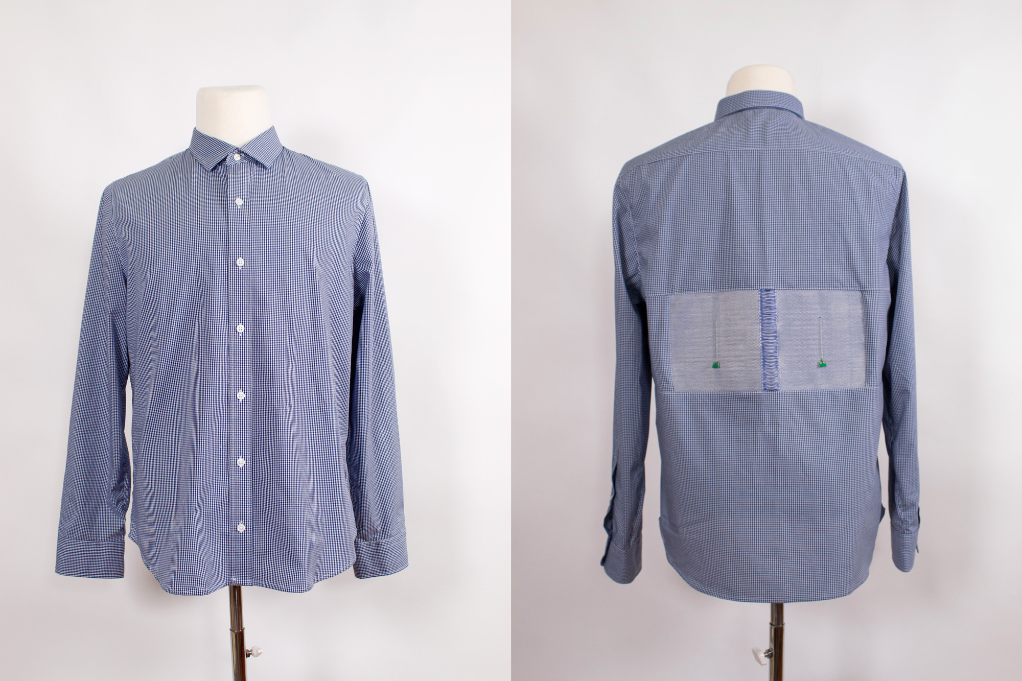 A blue shirt shown from the front and back. On the back are two lighter fabric panels.