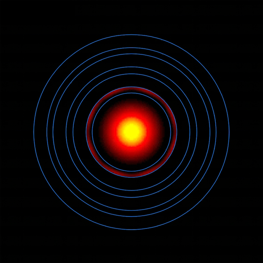 In the center of a black field are several concentric rings. The innermost ring holds a circle that is bright yellow in the center and fades to a deep red toward the outer edge. The next ring out contains a faint gradient of dark red fading into black.