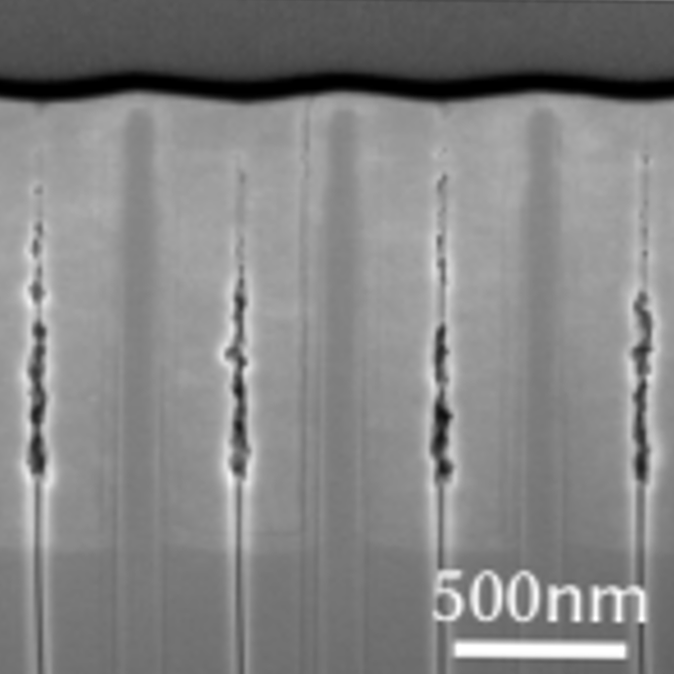 Cross section image of a photonic crystal show a thin (but not completely flat) capping layer, with about 50-60 nm thickness. (Image: Courtesy of the Researchers)