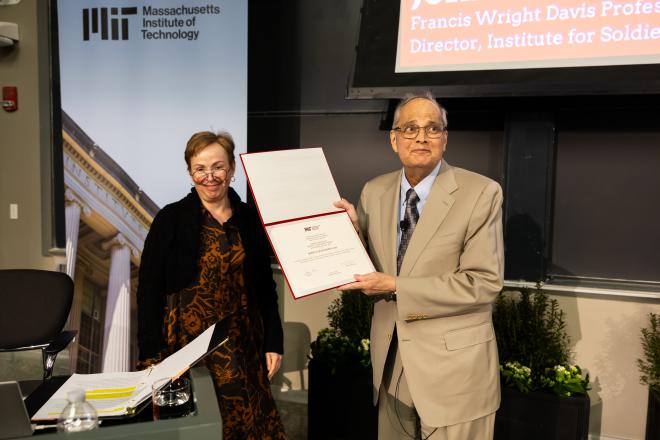 ISN Director Prof. John Joannopoulos receives the Killian Award certificate from Chair of the MIT Faculty Prof. Mary Fuller