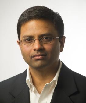Prof. Varanasi from the chest up in front of a white background